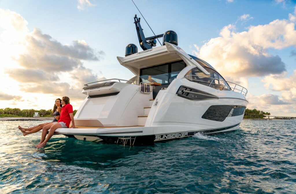 Sunseeker Predator 55 EVO from rear with two people seated on bathing platform