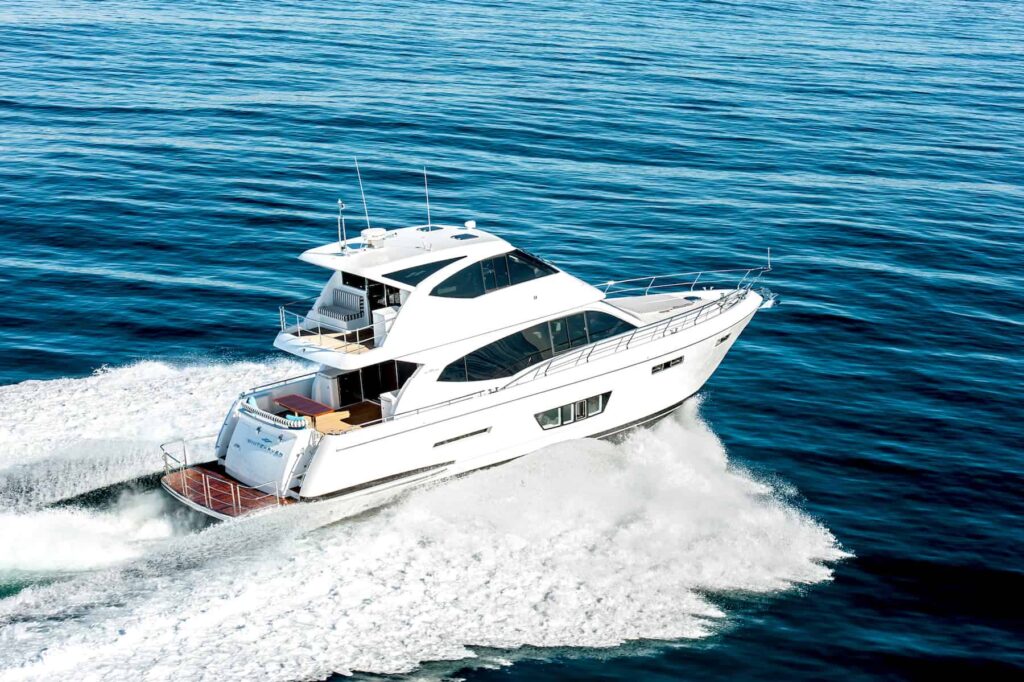 Whitehaven Flybridge 6000 pictured cruising from the rear