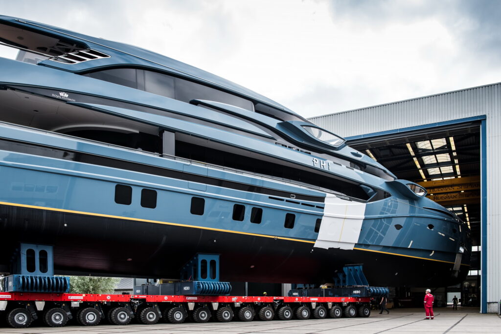 Royal Huisman's project PHI being transported from warehouse on wheels