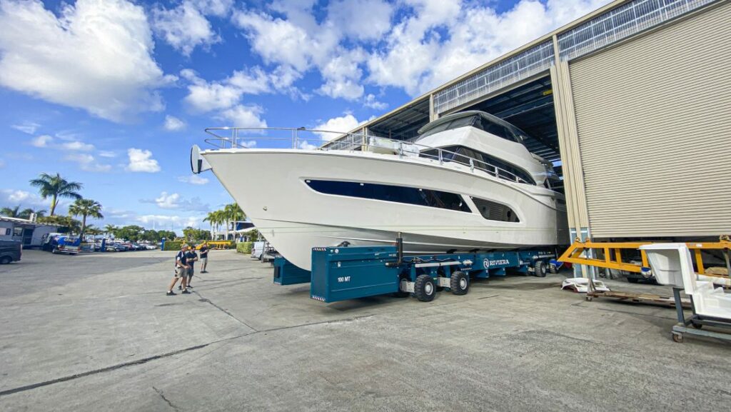 Riviera 78 Motor Yacht being moved from warehouse facility