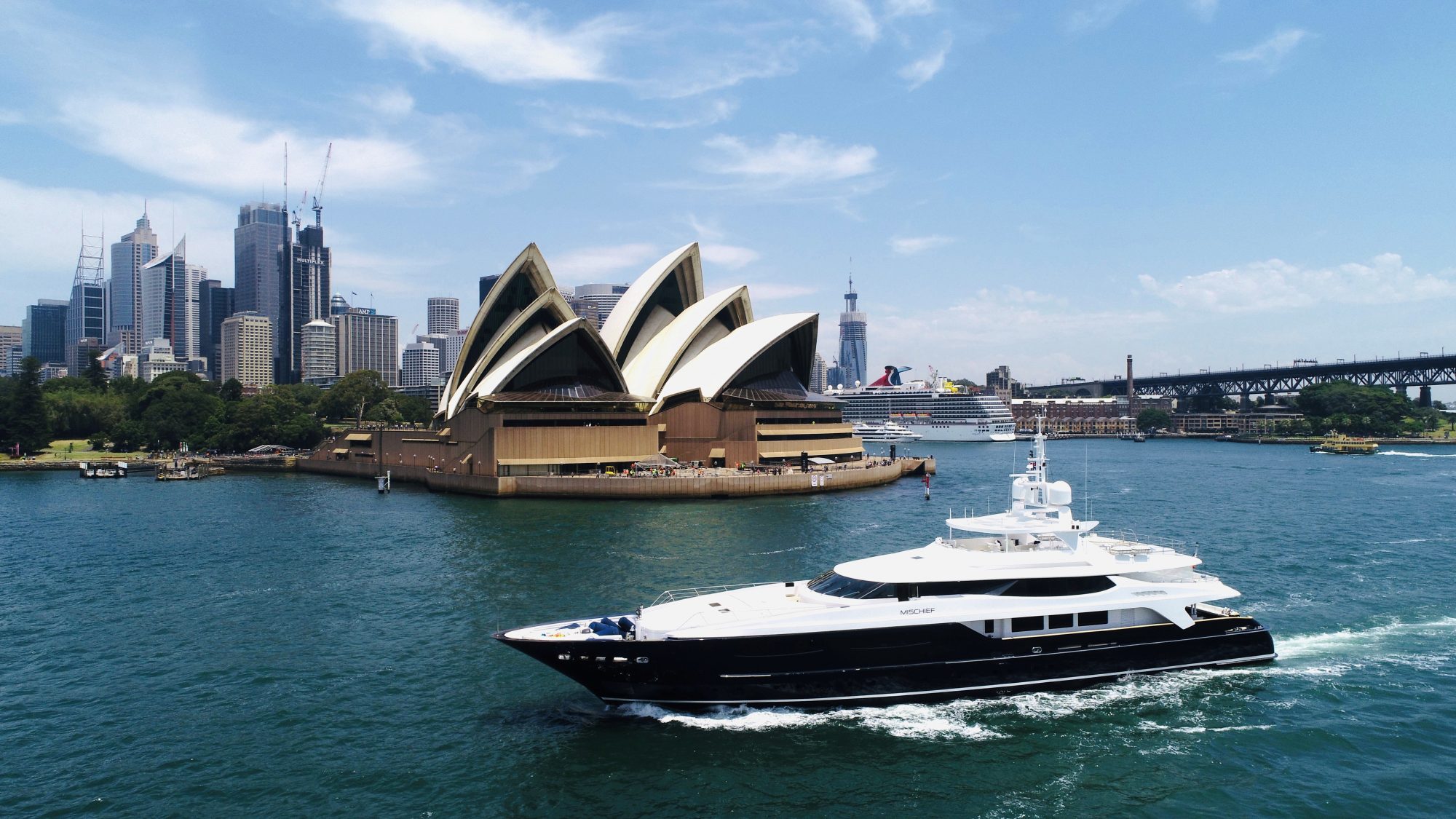 Superyacht Australia Mischief X cruising in front of the Opera House