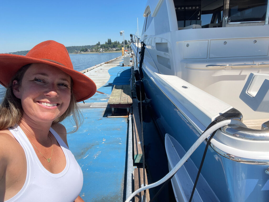 Owner taking a selfie with her Riviera 64 Sports Yacht