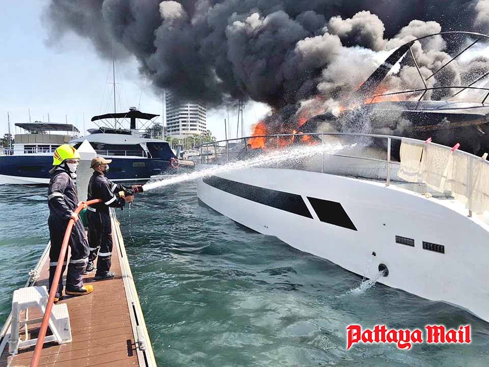 Pattaya Mail photo if yach fire being extinguished from dock
