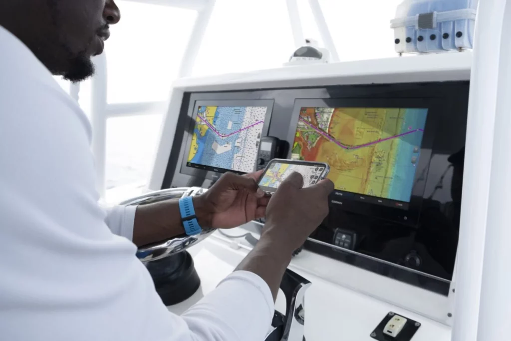 Man using Garmin marine cartography software