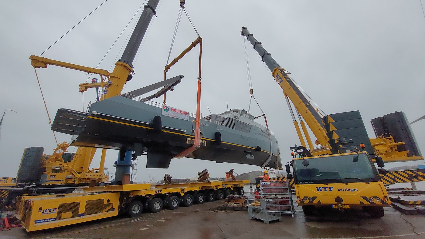 Expedition yacht NO DESTINATION being lifted by crane front angle
