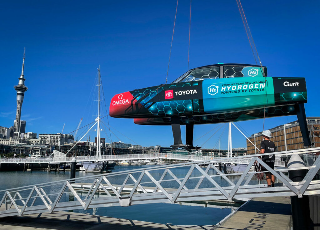 ETNZ hydrogen-powered foiling chase boat being lowered into the water.