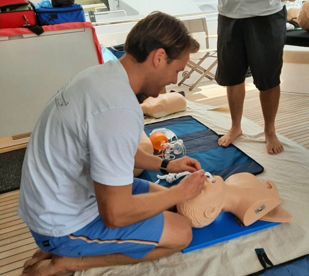 Person resuscitating dummy for